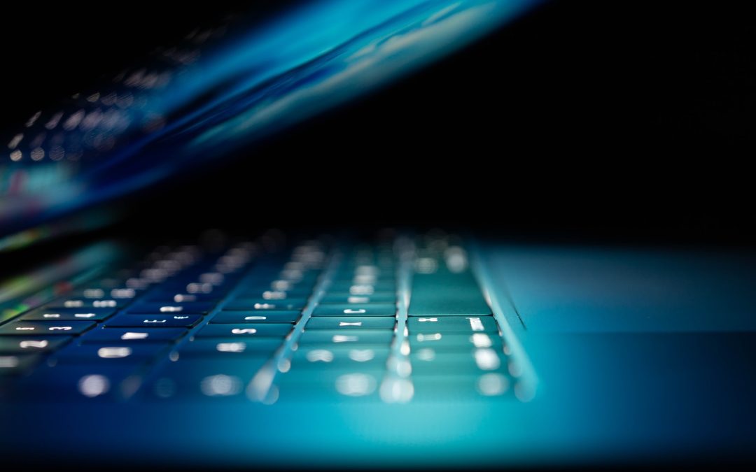 closeup photo of turned-on blue and white laptop computer